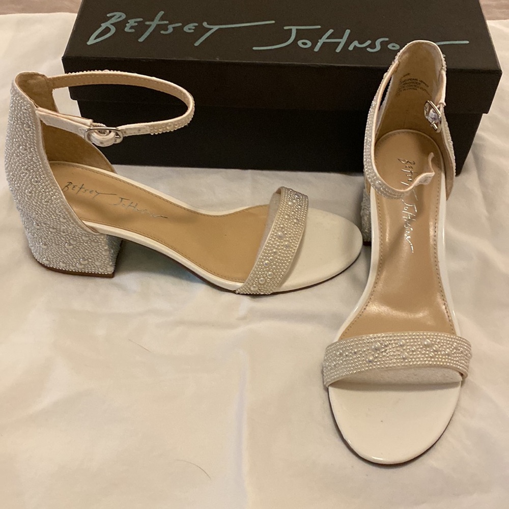 Betsy Johnson white pearl ‘Mari’ shoes with Tiffany blue sole.